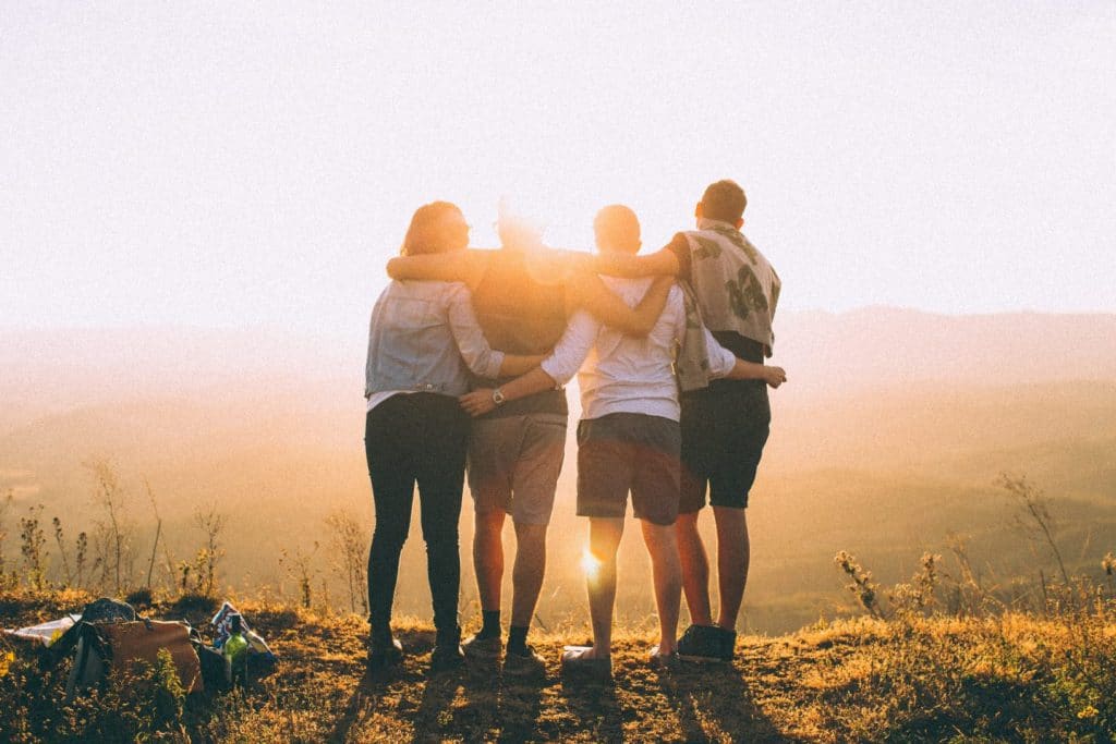 4 people looking at sunset