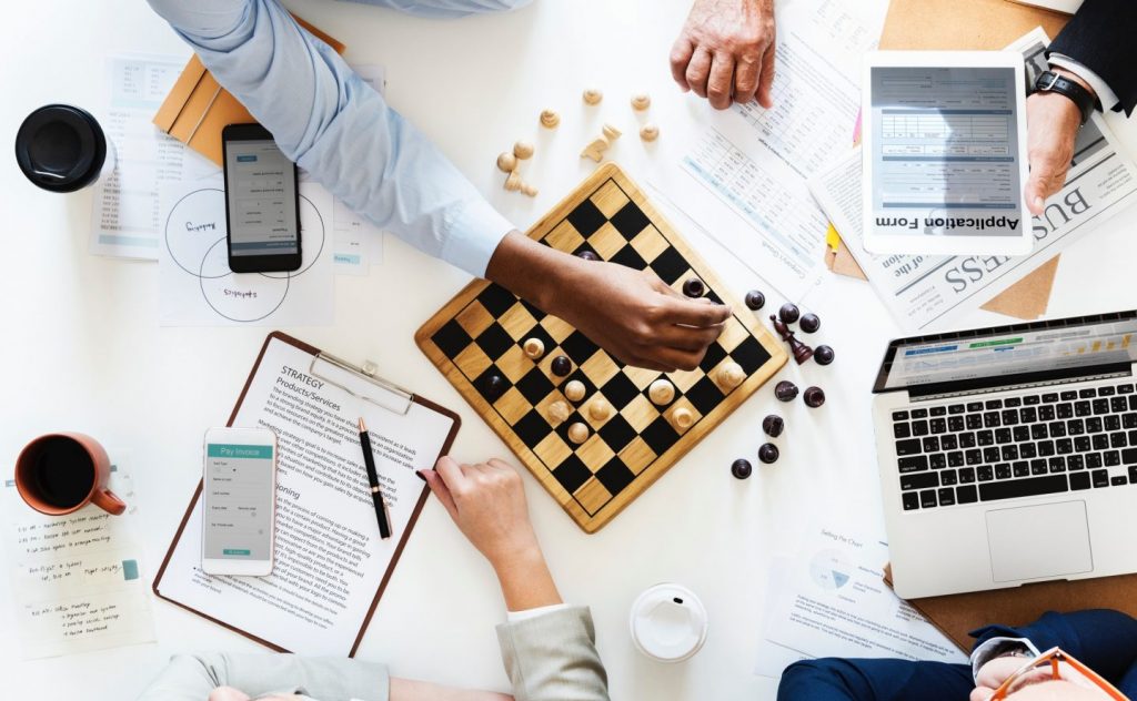 business team playing chess